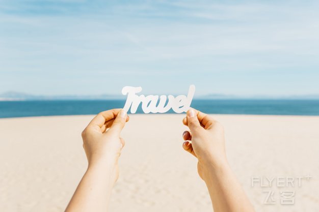 beach-concept-with-hands-holding-travel-letters_23-2147836108.jpg